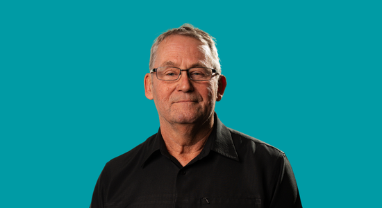 One of Berneslai Homes' Board members, Councillor Neil Young, superimposed on a light blue background.