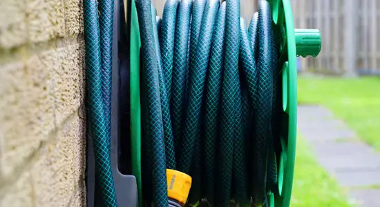 A garden hose that has been coiled neatly.png