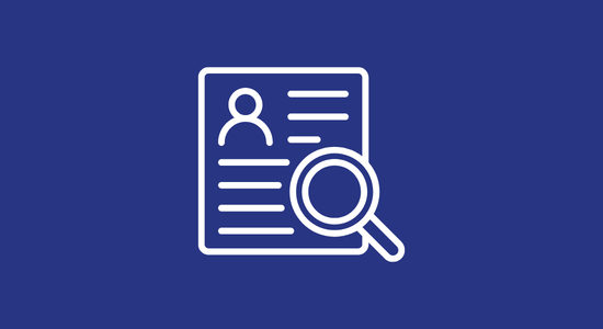 A magnifying glass looking at a job application
