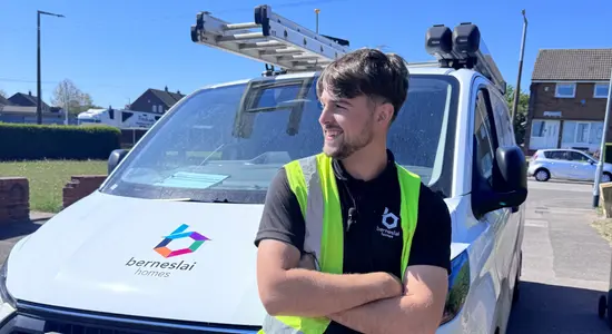A colleague standing in front of a Berneslai Homes van.png