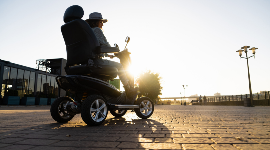 Lady Riding A Mobility Scooter